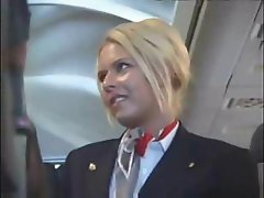 Horny blonde stewardess servicing aroused male passengers on board