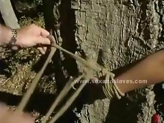 Sex slave tied from tree then forced to suck cocks and fucked in violent sado maso sex