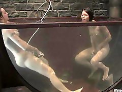 Twisted, nasty sluts fuck each other in an exotic underwater scene