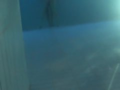 Young couple in action in pool underwater sexy ass