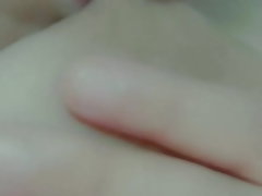 Curvy horny girl sucks her own nipples while masturbating