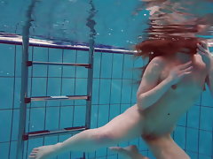 Pretty Polish teen Alice swimming without clothes on